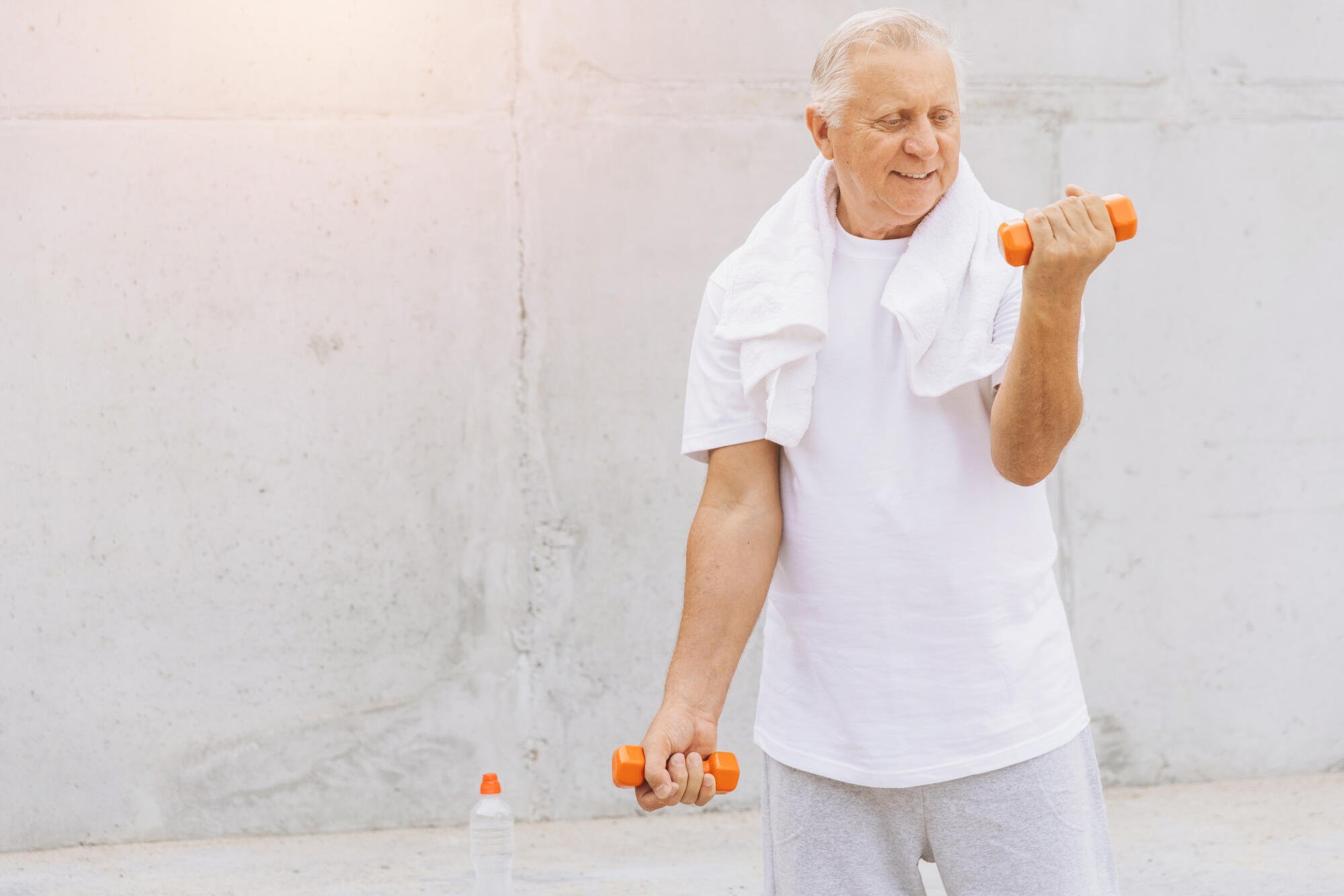 Senior-Man-Exercising-with-Dum-3